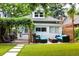 Backyard view with outdoor seating and a wood pergola next to a lush green lawn, providing a great space for relaxation at 3427 W 29Th Ave, Denver, CO 80211