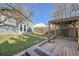 Inviting backyard with green lawn, stone pavers, and a charming pergola at 3427 W 29Th Ave, Denver, CO 80211