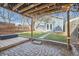 A backyard with a brick patio, fire pit, wooden deck, and pergola great for gatherings with friends and Gathering at 3427 W 29Th Ave, Denver, CO 80211