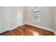 Cozy bedroom with hardwood floors, natural light, and neutral walls at 3427 W 29Th Ave, Denver, CO 80211