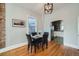 Stylish dining room with hardwood floors, modern lighting, and view to kitchen at 3427 W 29Th Ave, Denver, CO 80211