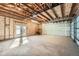 Large garage with unfinished walls and exposed wooden rafters at 3427 W 29Th Ave, Denver, CO 80211