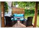 Cozy outdoor patio space with comfortable seating, a fire pit, and a wooden privacy fence, perfect for relaxation at 3427 W 29Th Ave, Denver, CO 80211