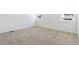 Bedroom features neutral carpet, white walls and base trim with windows bringing in the natural light at 18951 E 96Th Pl, Commerce City, CO 80022