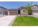 Charming single-Gathering home featuring a well-manicured lawn and a two-car garage at 18951 E 96Th Pl, Commerce City, CO 80022