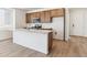 Modern kitchen featuring stainless steel appliances and a large island at 18951 E 96Th Pl, Commerce City, CO 80022