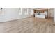 Bright living room with wood floors and an open layout with modern kitchen and plenty of natural light at 18951 E 96Th Pl, Commerce City, CO 80022