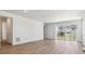 Spacious open-plan living room with sleek flooring and bright light at 18951 E 96Th Pl, Commerce City, CO 80022