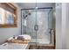 Bright bathroom featuring a walk-in shower and a soaking tub by the window at 1391 S Winston Dr, Golden, CO 80401