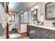 Modern bathroom with double vanity, sleek glass shower, and soaking tub at 1391 S Winston Dr, Golden, CO 80401