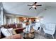 Spacious living room leading into a modern kitchen with wood cabinets and an adjacent dining area at 1391 S Winston Dr, Golden, CO 80401