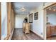 Bright sunroom featuring wood-paneled walls, rustic furniture, and an abundance of natural light at 1391 S Winston Dr, Golden, CO 80401