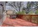 A spacious wooden deck with a hot tub provides a perfect spot for relaxation and entertainment at 17912 E Milan Pl, Aurora, CO 80013