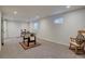 Spacious basement provides versatile space for a game room, with carpet flooring at 17912 E Milan Pl, Aurora, CO 80013