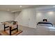 Finished basement featuring carpet floors and an open layout, perfect for recreation at 17912 E Milan Pl, Aurora, CO 80013
