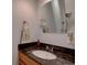 Bathroom with a sink, granite countertop, and a mirror at 17912 E Milan Pl, Aurora, CO 80013