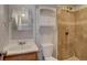 Well-lit bathroom features a tiled shower, providing a clean and modern look at 17912 E Milan Pl, Aurora, CO 80013