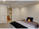 Cozy bedroom featuring neutral tones and an adjoining bathroom for added convenience at 17912 E Milan Pl, Aurora, CO 80013