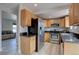 Kitchen with stainless steel appliances, hardwood cabinets, and granite countertops at 17912 E Milan Pl, Aurora, CO 80013