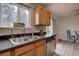 Kitchen sink and countertop with a view out the window to the backyard at 17912 E Milan Pl, Aurora, CO 80013