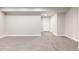 A second view of the spacious basement with carpet flooring and white walls at 533 Red Thistle Dr, Highlands Ranch, CO 80126