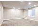 A large basement area with carpet, recessed lighting, and one window at 533 Red Thistle Dr, Highlands Ranch, CO 80126