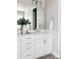 Well-lit bathroom featuring a modern vanity, large mirror, and stylish tile flooring at 533 Red Thistle Dr, Highlands Ranch, CO 80126