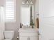 Bright bathroom featuring a vanity, mirror, and toilet at 533 Red Thistle Dr, Highlands Ranch, CO 80126