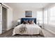 Inviting bedroom with a blue headboard, decorative pillows, two bedside lamps, and a fluffy rug at 533 Red Thistle Dr, Highlands Ranch, CO 80126