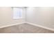 The bedroom has carpet flooring, white walls, and one window at 533 Red Thistle Dr, Highlands Ranch, CO 80126