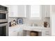 Charming kitchen featuring white cabinets, countertops, and an oven at 533 Red Thistle Dr, Highlands Ranch, CO 80126