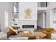 Cozy living room boasts a modern fireplace, two-story ceilings, and neutral decor, creating a comfortable and inviting space at 533 Red Thistle Dr, Highlands Ranch, CO 80126
