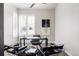 Contemporary home office featuring a sleek desk, modern chairs, and natural light, creating an ideal work environment at 533 Red Thistle Dr, Highlands Ranch, CO 80126