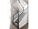 Elegant staircase with white railings and a black banister at 533 Red Thistle Dr, Highlands Ranch, CO 80126