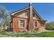 A charming brick house with a distinctive chimney and well-maintained landscaping at 5475 W 1St Ave, Lakewood, CO 80226