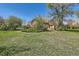 Exterior house view with a large front yard at 5475 W 1St Ave, Lakewood, CO 80226