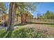 The side of this house features brickwork, nice windows and manicured shrubbery at 5475 W 1St Ave, Lakewood, CO 80226