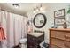 Bathroom featuring a vanity with a granite countertop, warm lighting, and decorative accents, and a framed mirror at 5758 S Jasper Way, Centennial, CO 80015