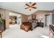 Bright main bedroom with a ceiling fan, furniture, and natural light at 5758 S Jasper Way, Centennial, CO 80015