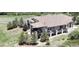 Aerial perspective showcasing the home's expansive decks and verdant landscaping at 1272 Nightfire Cir, Castle Rock, CO 80104