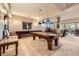 Inviting basement area with a pool table, bar, and comfortable seating, perfect for entertaining at 1272 Nightfire Cir, Castle Rock, CO 80104