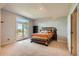 Cozy bedroom with large windows, natural light, and walkout door to patio space at 1272 Nightfire Cir, Castle Rock, CO 80104