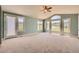 Spacious carpeted bedroom with plenty of natural light and a door leading outside at 1272 Nightfire Cir, Castle Rock, CO 80104