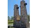 Bell Mountain Ranch stone entrance with stone columns and signage amidst a beautiful blue sky at 1272 Nightfire Cir, Castle Rock, CO 80104