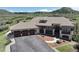 Gorgeous home with a three-car garage, stone detailing, steps to the entrance, and a lush landscape at 1272 Nightfire Cir, Castle Rock, CO 80104