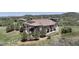 Stunning home with a walkout basement nestled among trees and landscaping with wrap-around deck and mountain views at 1272 Nightfire Cir, Castle Rock, CO 80104