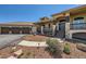 Elegant home showcasing a three-car garage, a stone-accented facade, and manicured front yard landscaping at 1272 Nightfire Cir, Castle Rock, CO 80104