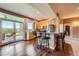 Modern kitchen featuring stainless steel appliances, granite countertops, and bar seating with patio views at 1272 Nightfire Cir, Castle Rock, CO 80104