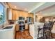 Bright kitchen featuring stainless steel appliances, light wood cabinets, and adjacent dining space at 1272 Nightfire Cir, Castle Rock, CO 80104