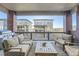 Back porch featuring outdoor furniture including a couch, chairs, and a table with a grill at 15646 W Floyd Dr, Morrison, CO 80465